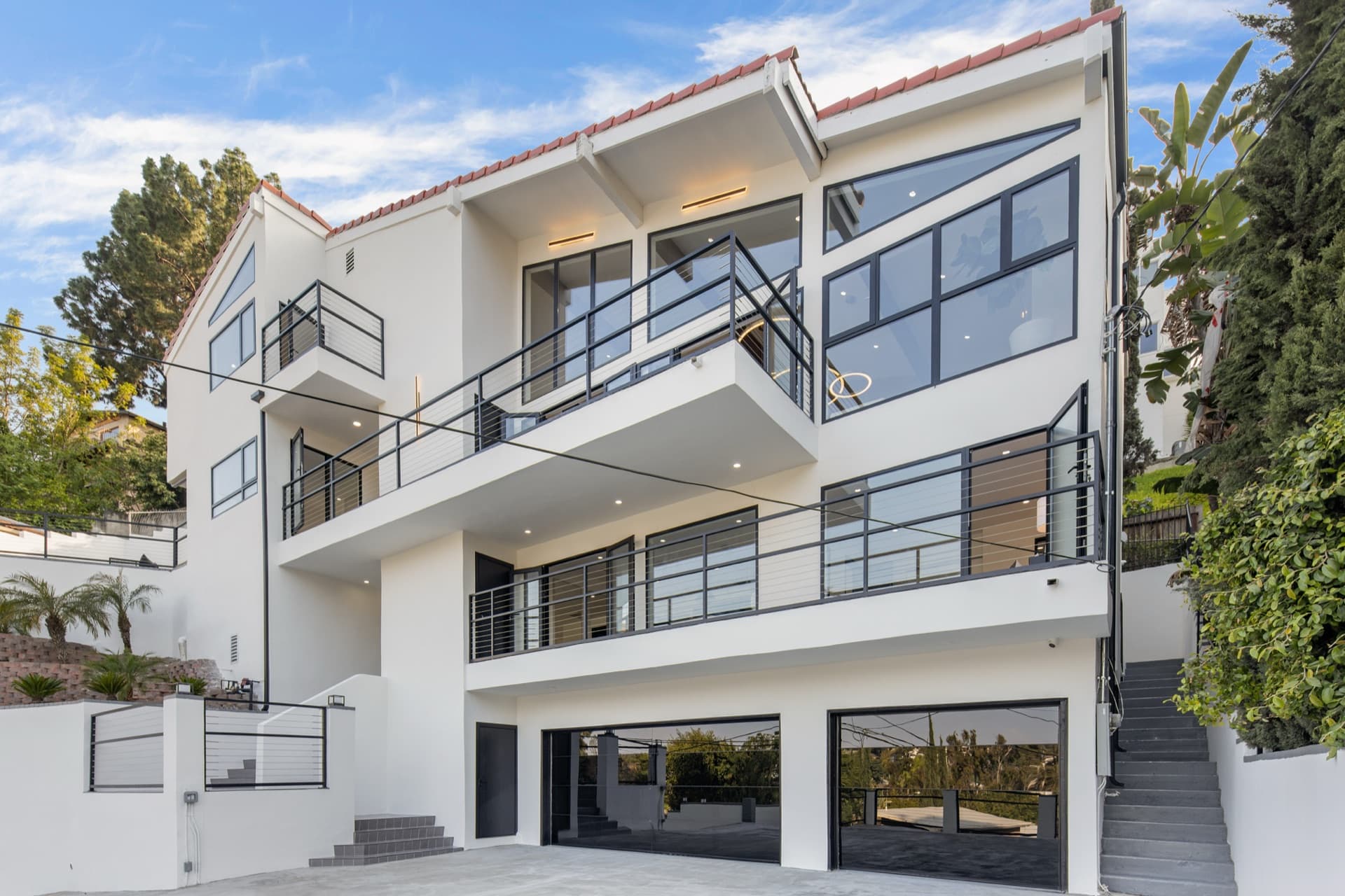 Glass-railed terraces on the rear elevation — Claremont Residence