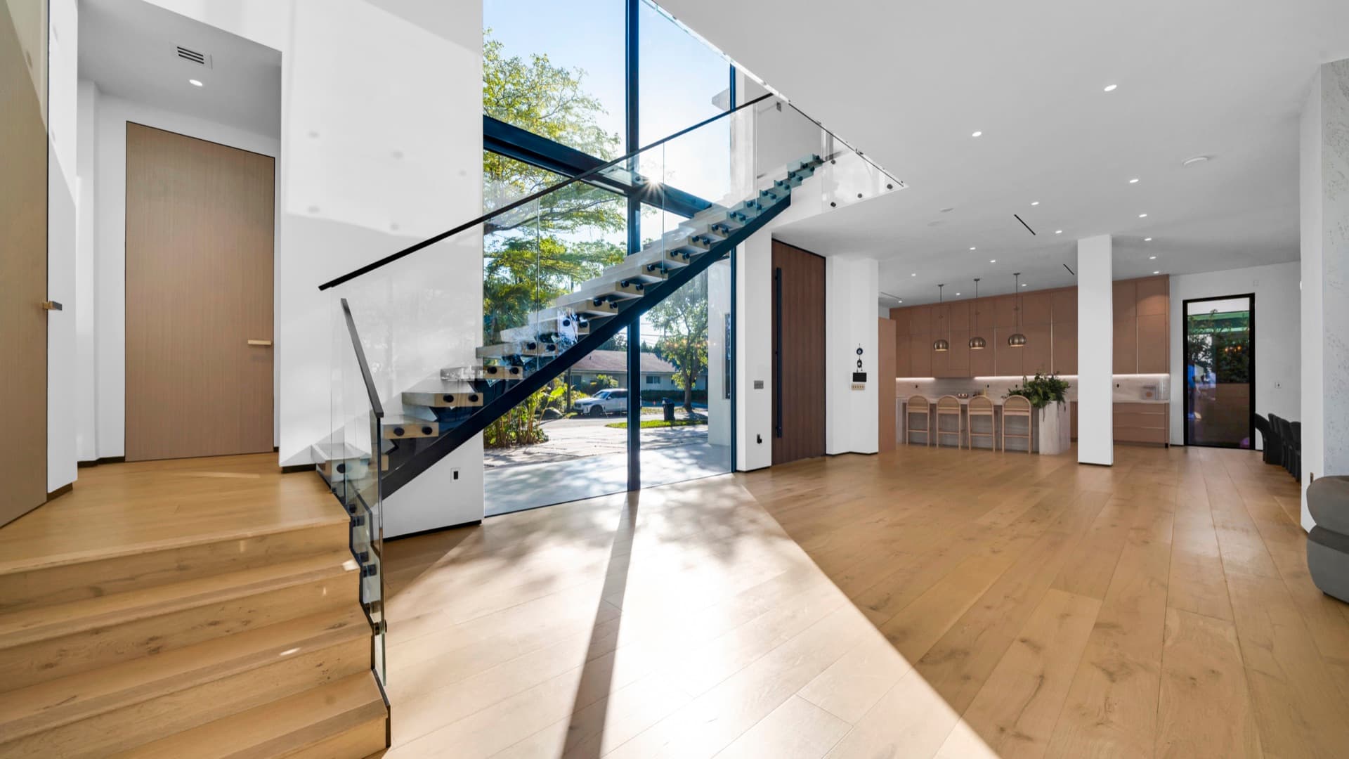 Double-height glazed stair hall — North Miami Beach Residence